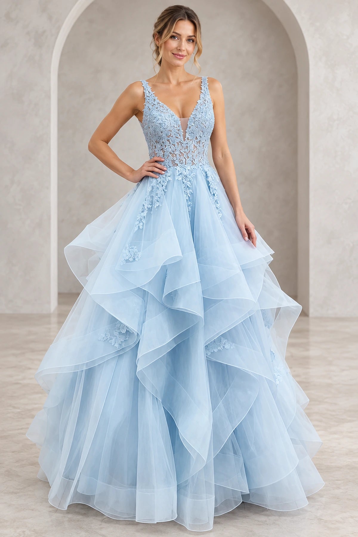Light blue ball gown prom dress with a deep V neckline, floral lace appliques, sleeveless straps, and cascading tiered tulle skirt by Graceprom.