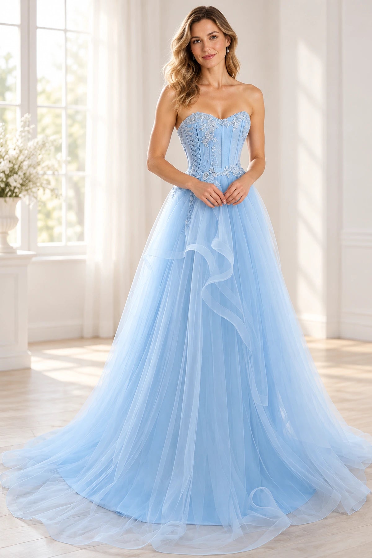 Light blue princess prom dress with a strapless sweetheart neckline, floral lace corset bodice, cascading tulle ruffles, and a flowing sweep train by Graceprom.