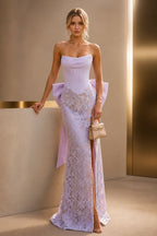 Lilac strapless wedding guest dress with corset bodice, lace skirt, front slit, and fitted mermaid silhouette