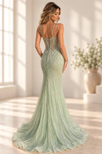 Mint green mermaid prom dress with lace up corset back, beaded details and flowing tulle skirt