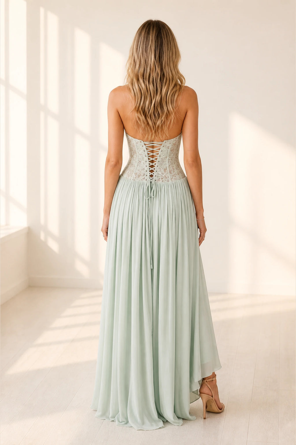Mint green wedding guest dress with lace up back and flowing floor length skirt