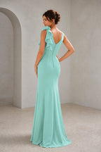 Back view of mint green wedding guest dress with V-back and covered buttons