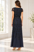 Navy blue mother of the bride dress with full floral bead embellishment and zipper back