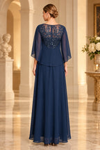 Navy blue mother of the bride dress with illusion lace back cape sleeves and zipper closure