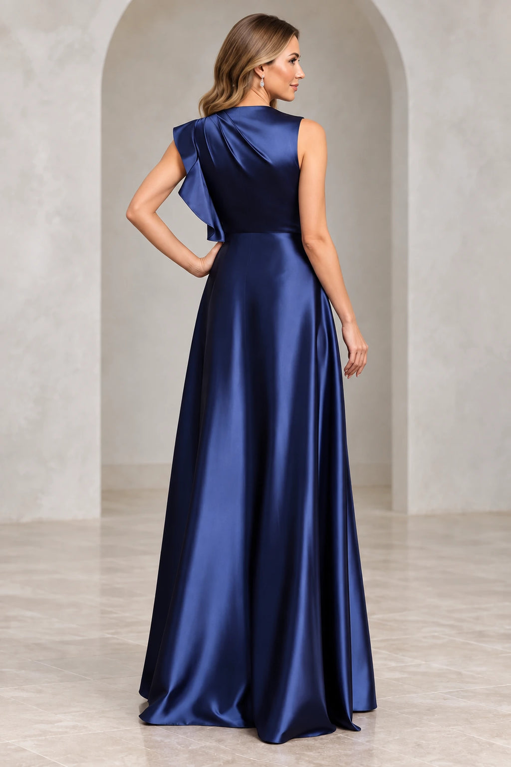 Back view of navy blue Mother of the Bride Dress with high neckline, shoulder ruffle and flowing floor-length skirt