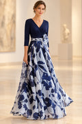 Navy and light blue A-line Mother of the Bride Dress with V-neck, three-quarter sleeves, floral waist accent and floor-length skirt