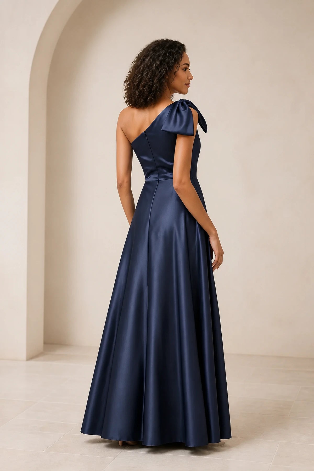 Navy blue one shoulder A-line prom dress with bow detail, fitted waist and floor-length skirt, front and back view