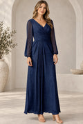 Navy blue Mother of the Bride Dress with V-neck, sheer long sleeves, defined waist and flowing floor-length skirt