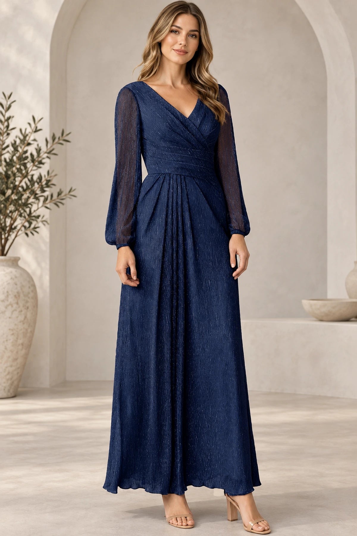 Navy blue Mother of the Bride Dress with V-neck, sheer long sleeves, defined waist and flowing floor-length skirt