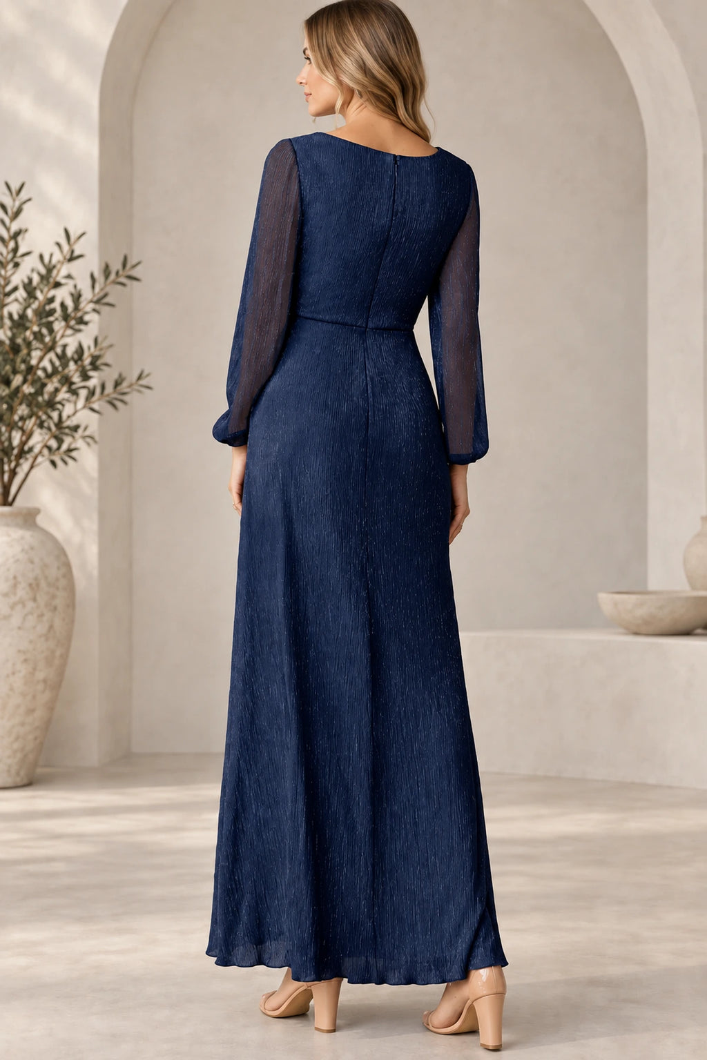 Back view of navy blue Mother of the Bride Dress with sheer long sleeves, closed neckline and floor-length A-line skirt