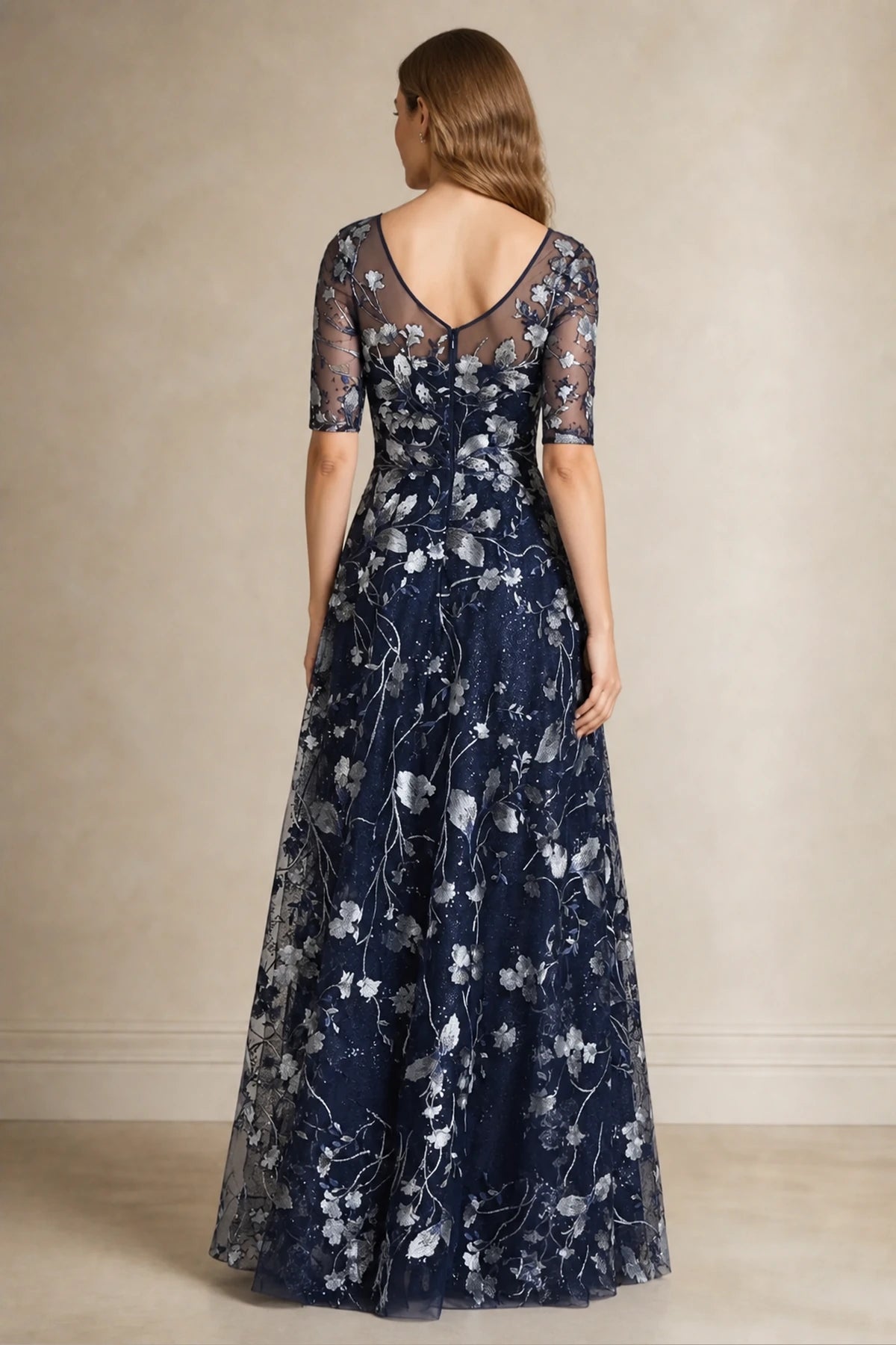 Navy A-line bateau neck Mother of the Bride dress with sheer elbow sleeves, silver floral embroidery and V-back, front and back view by Vedress