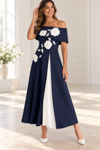 Navy Mother of the Bride Dress with off-shoulder neckline, white floral appliqués and contrasting pleated front panel