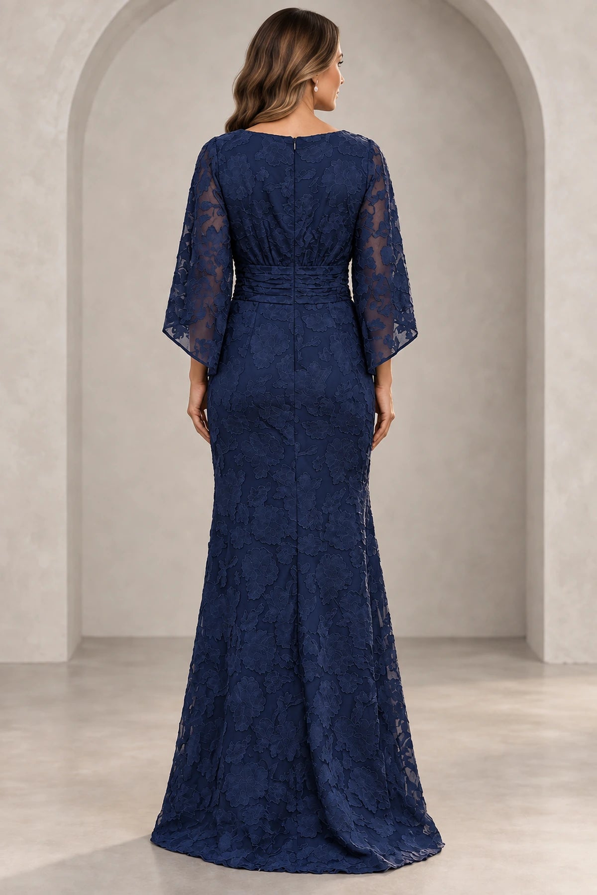 Back view of navy blue Mother of the Bride Dress with floral lace overlay, center zipper and floor-length sheath skirt