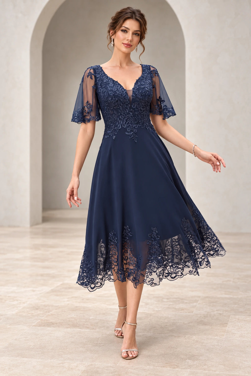 Navy mother of the bride dress with V neckline short illusion sleeves lace bodice and tea length A-line skirt