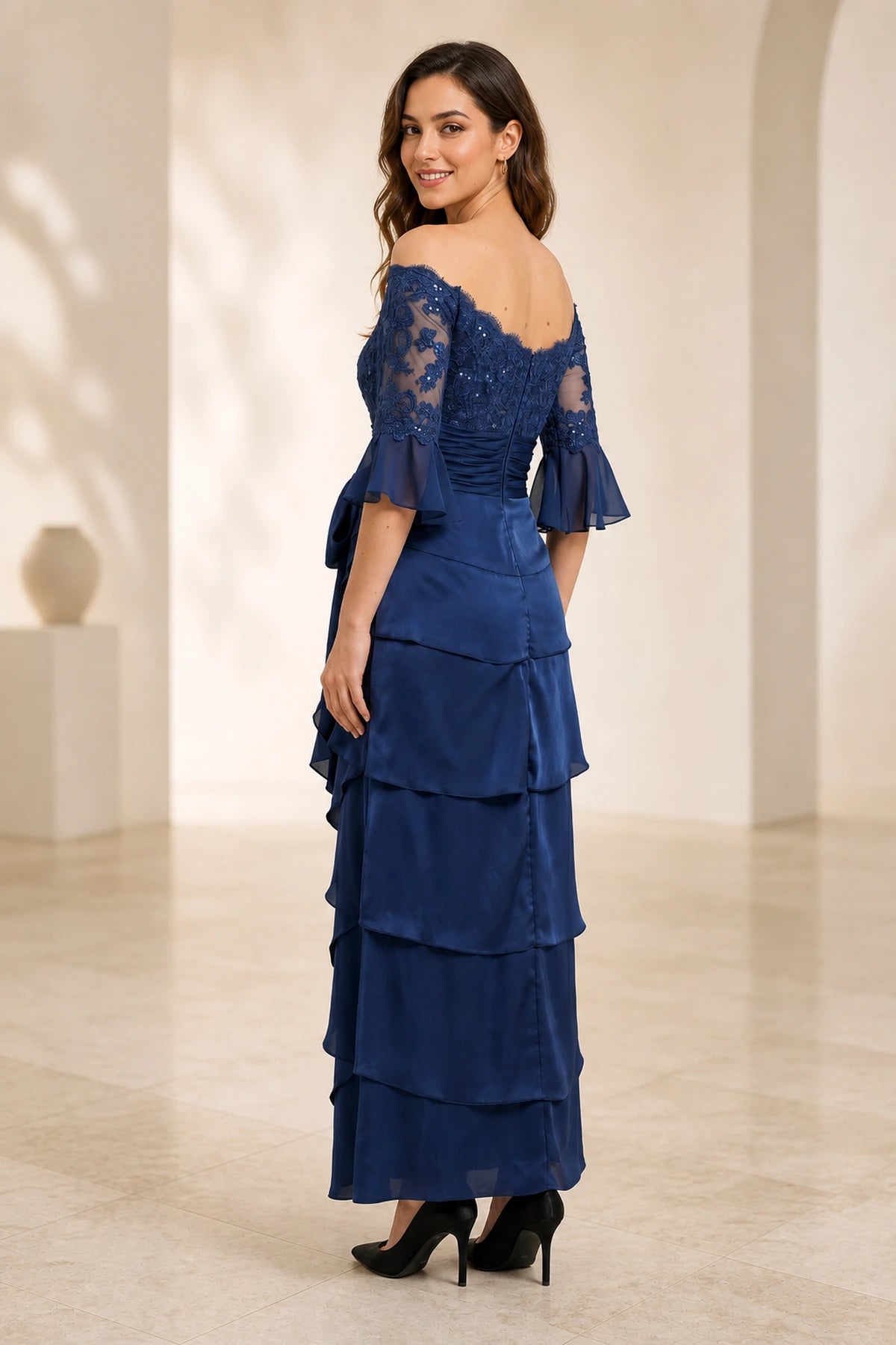 Navy floor length mother of the bride dress with lace back and layered skirt