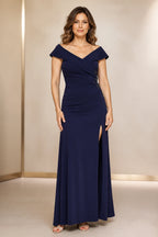 Navy wedding guest dress with off-shoulder neckline, ruched waist, side embellishment and front slit front view