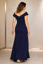 Navy floor-length wedding guest dress with V-shaped off-shoulder back and fitted silhouette back view