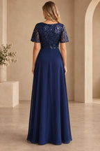 Back view of navy Mother of the Bride Dress with sequin bodice, short sleeves, center zipper and flowing A-line skirt