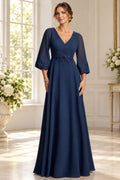 Navy Mother of the Bride Dress with V neckline bishop sleeves floral appliqué and floor length A-line silhouette