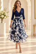 Navy and white floral Mother of the Bride Dress with V-neck bodice, three-quarter sleeves and full A-line skirt