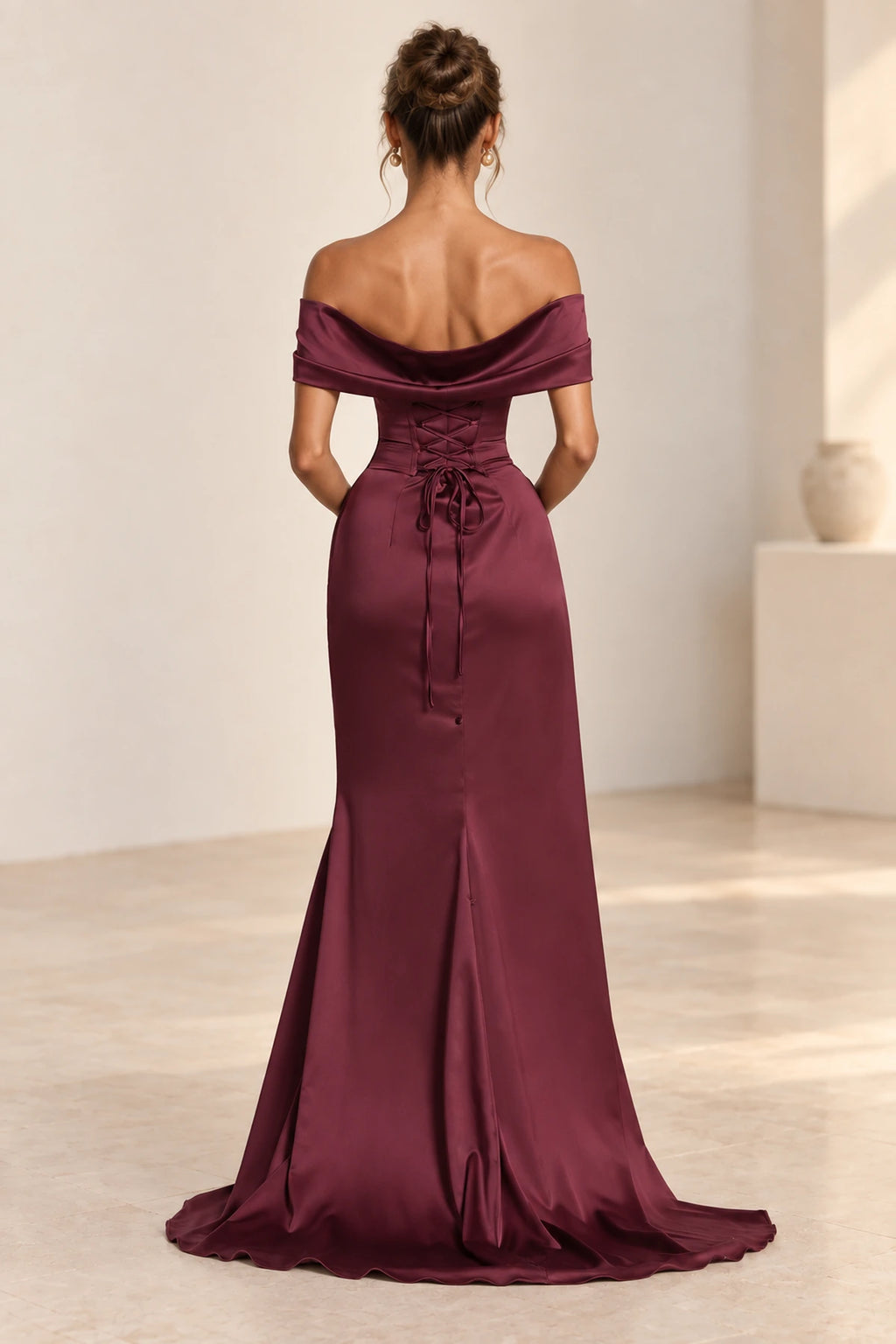 Corset lace up back detail of luxury formal wedding guest gown