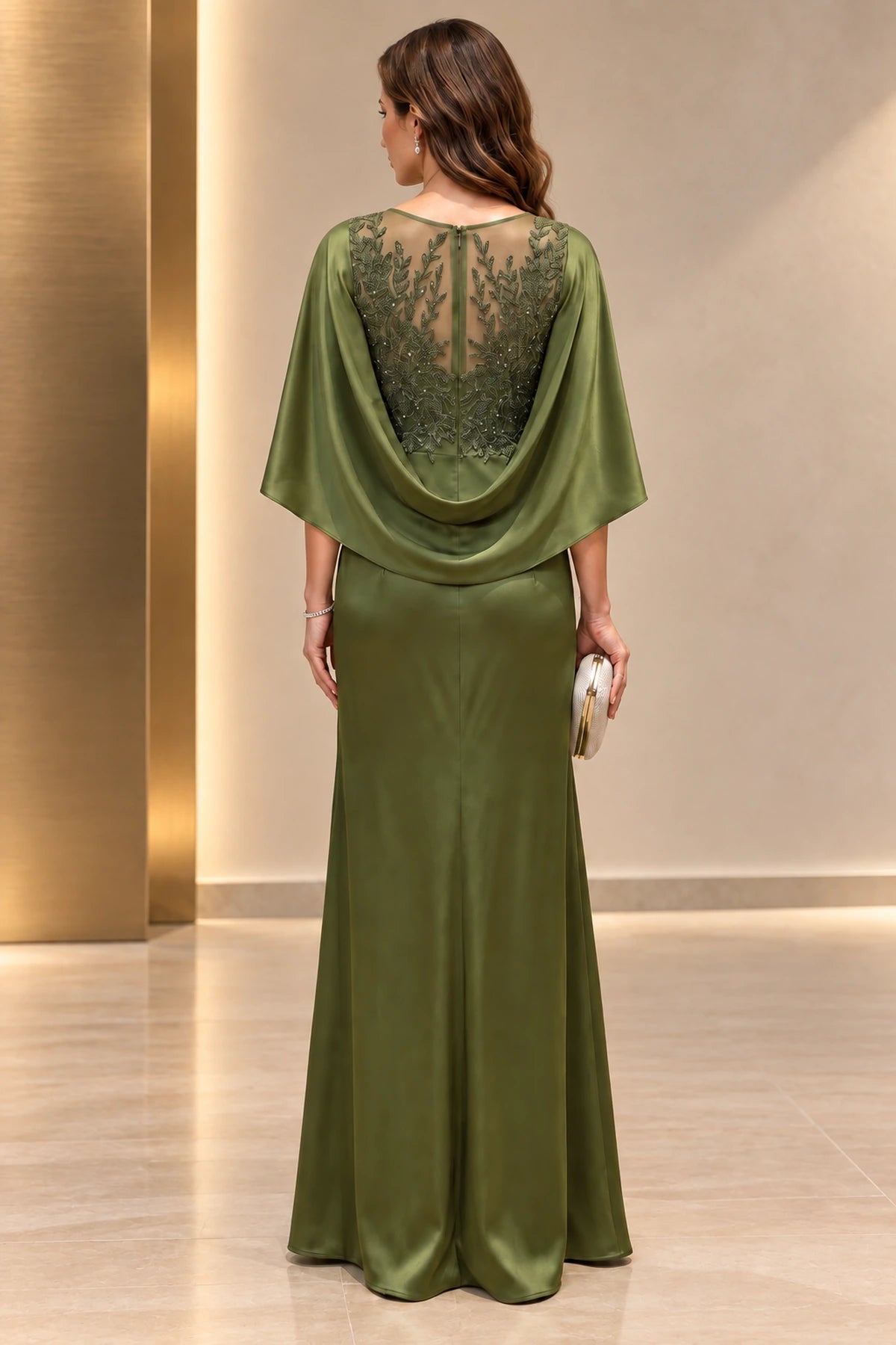 Back view of olive green Mother of the Bride Dress with sheer floral appliqué back and draped cape sleeves