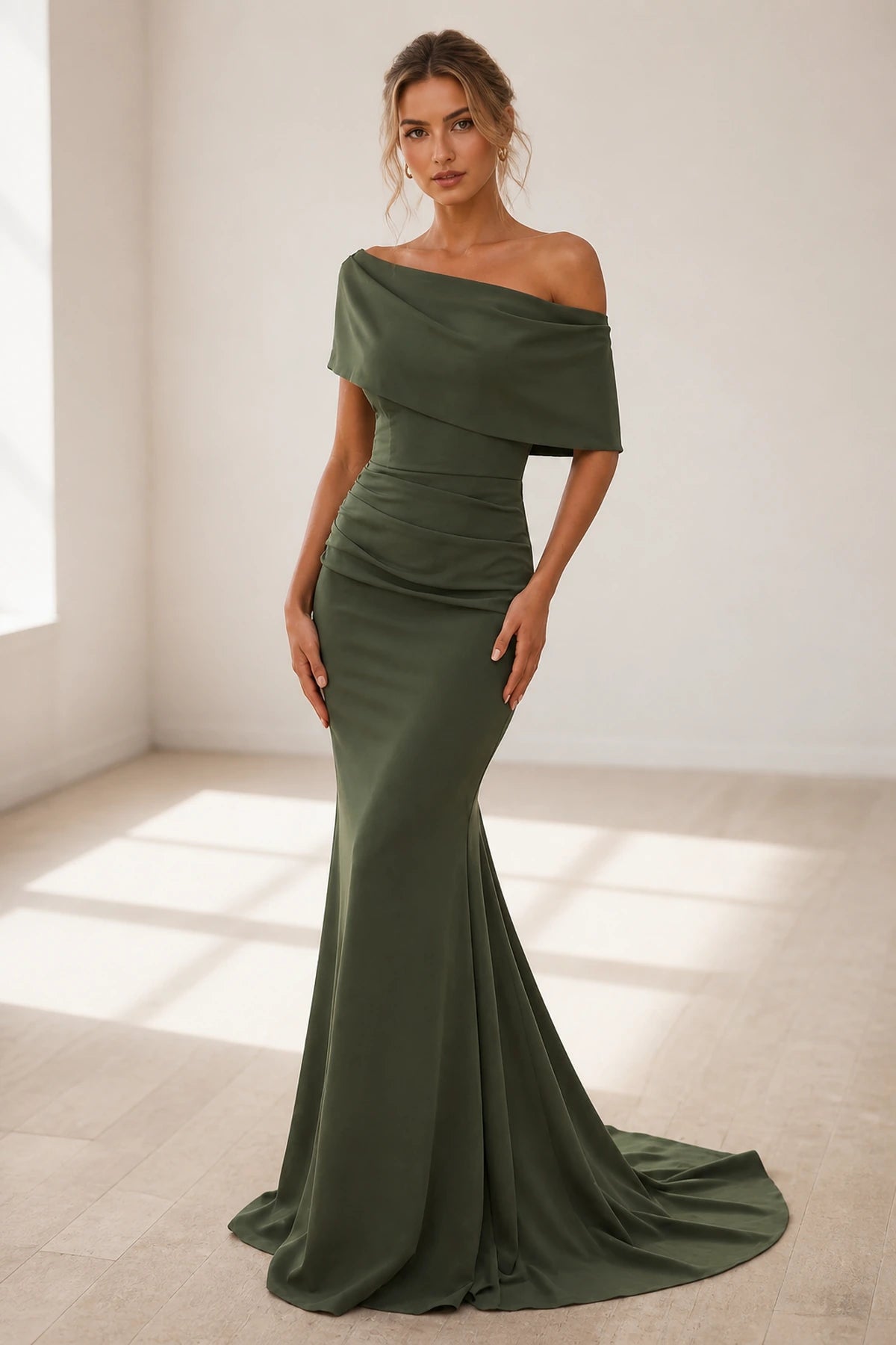 Olive green off-shoulder wedding guest dress with draped neckline, ruched waist, mermaid silhouette and floor-length hem