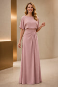 Dusty rose mother of the bride dress with boat neckline, short sleeves, ruched waist and floor-length A-line skirt