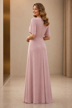 Back view of dusty rose mother of the bride dress with short sleeves, closed back and floor-length A-line silhouette