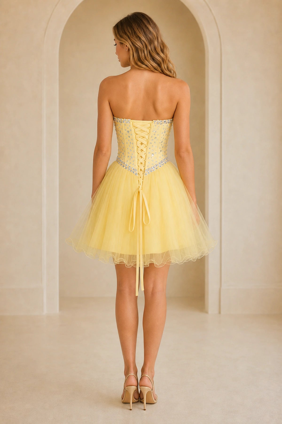 Yellow lace up back homecoming Dress with rhinestone beaded bodice and tulle skirt back view