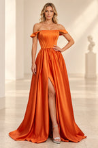 Orange A line prom dress with folded off shoulder bands, a paneled corset-style bodice, slim waist tie, and high front slit.