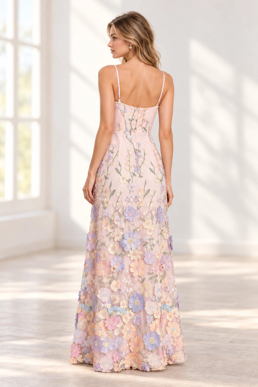 Pink floral bridesmaid dress with delicate straps and full length flowing skirt back