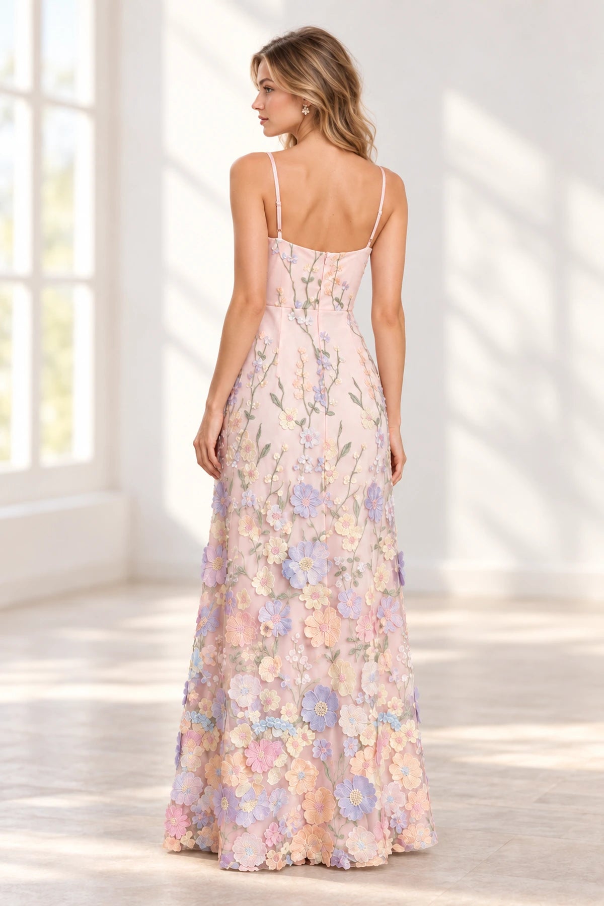 Pink floral bridesmaid dress with delicate straps and full length flowing skirt back
