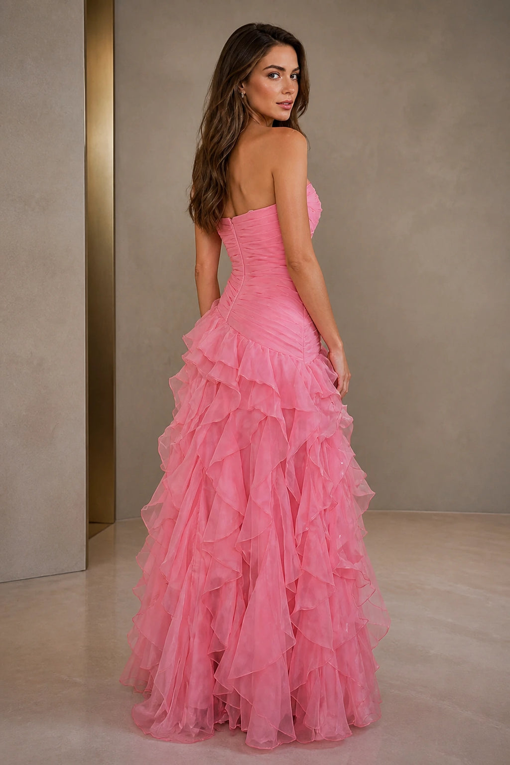 Pink strapless bridesmaid dress with fitted back and cascading tiered ruffle skirt