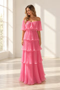 Pink pleated chiffon A-line wedding guest dress with off shoulder neckline, flutter sleeves, tiered ruffle skirt and floor length hem by Graceprom