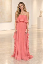 Coral pink pleated chiffon strapless wedding guest dress with ruffle overlay, flowing sheath silhouette, cascading side ruffles and floor length skirt by Graceprom