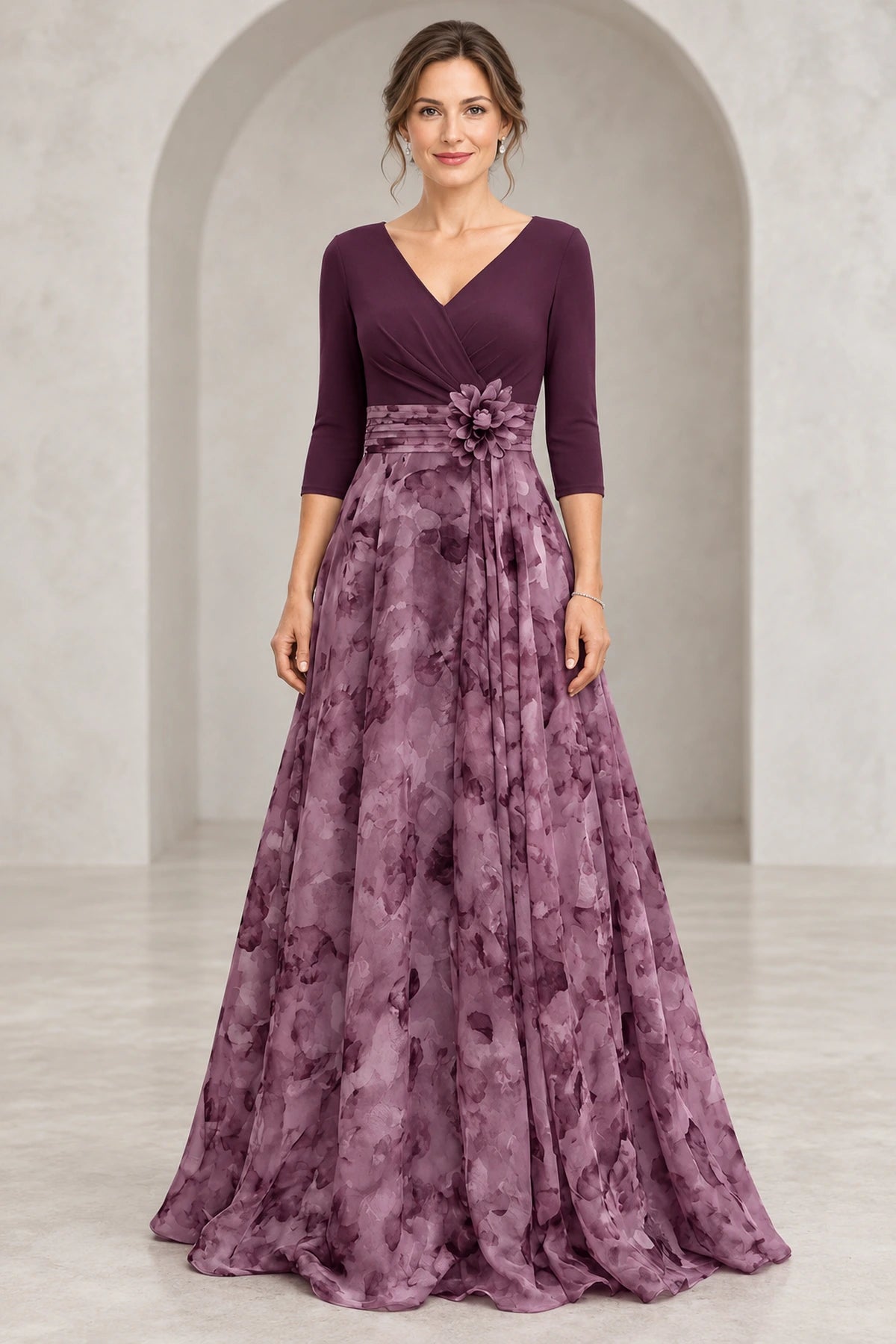 Plum Mother of the Bride Dress with V-neck bodice, 3/4 sleeves, waist flower detail, and floral floor-length A-line skirt