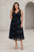 Plus size black tea-length mother dress with V-neck sleeveless bodice and pleated floral overlay