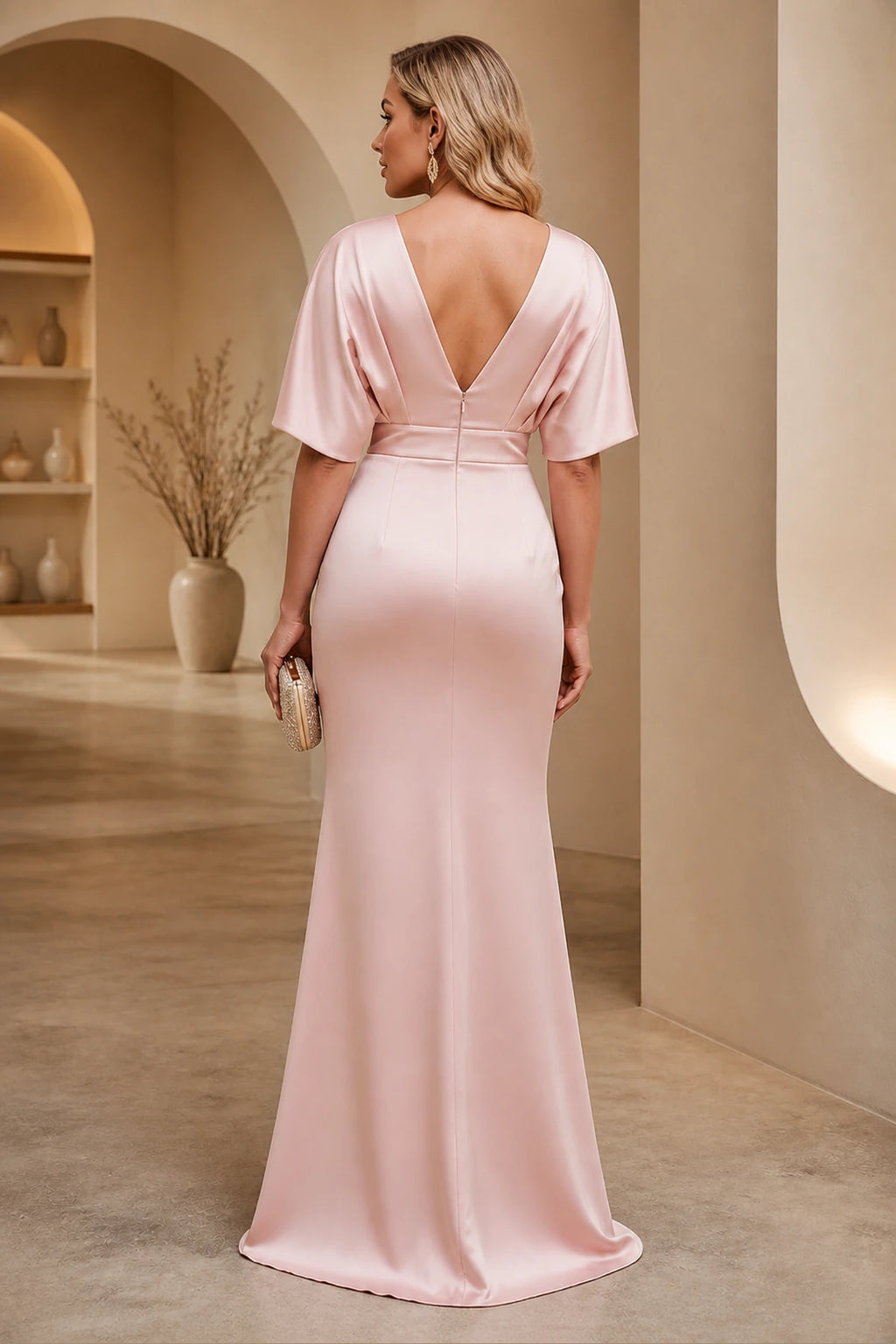 Plus size blush pink wedding guest dress with deep V back and zipper