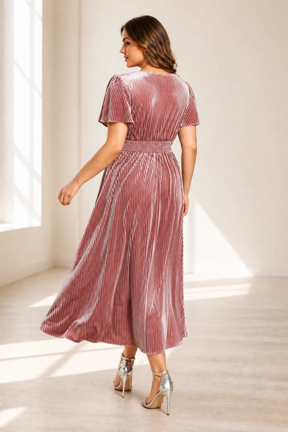 Plus size dusty rose mother of the bride dress with V neckline flutter sleeves and tea length skirt