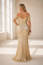 Plus size gold wedding guest dress with zip back and mermaid hem