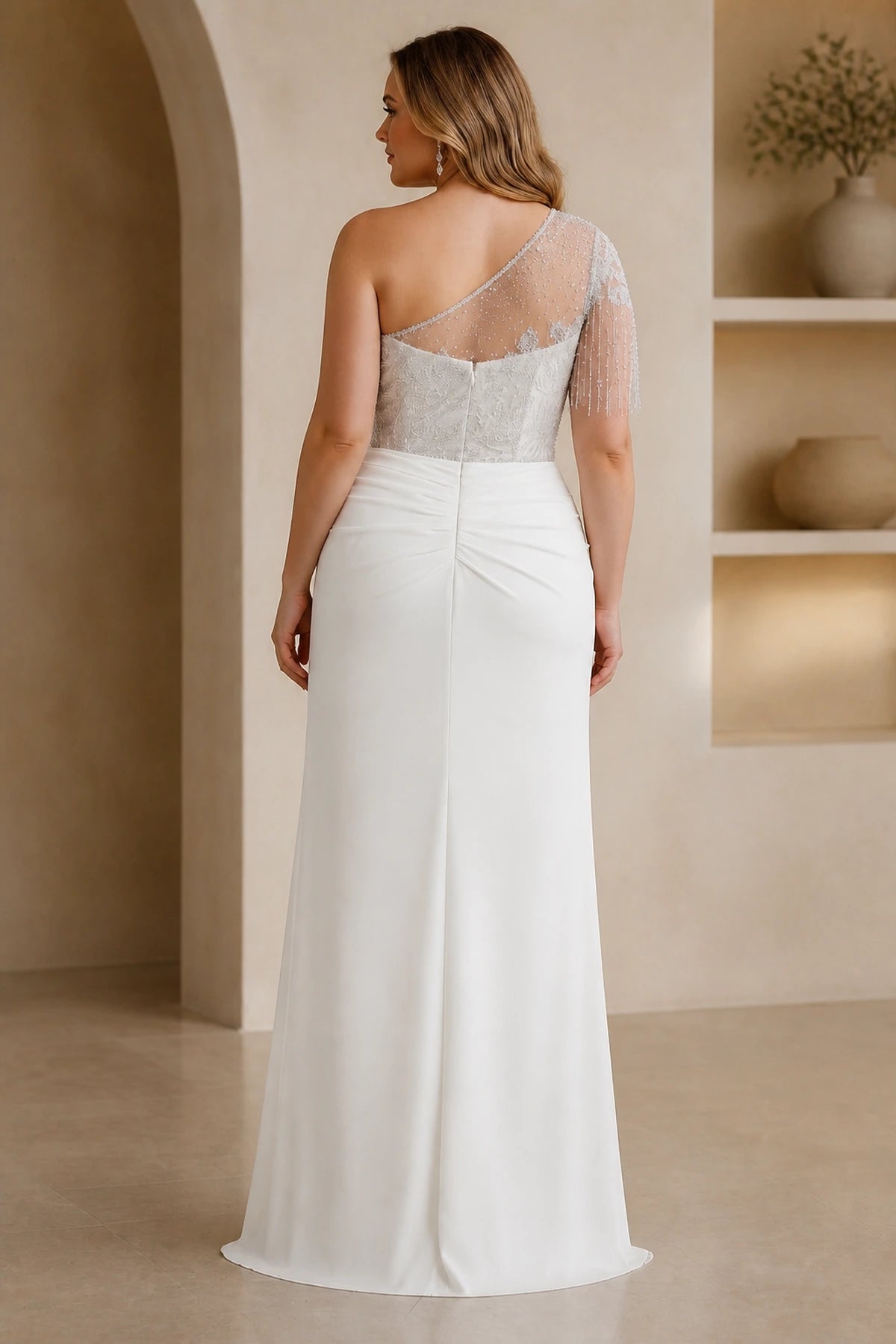 Back view of white plus size wedding guest dress with one-shoulder beading and zipper closure