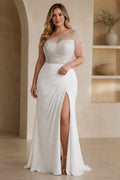 White one-shoulder plus size wedding guest dress with beaded fringe and front slit