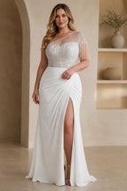 White one-shoulder plus size wedding guest dress with beaded fringe and front slit