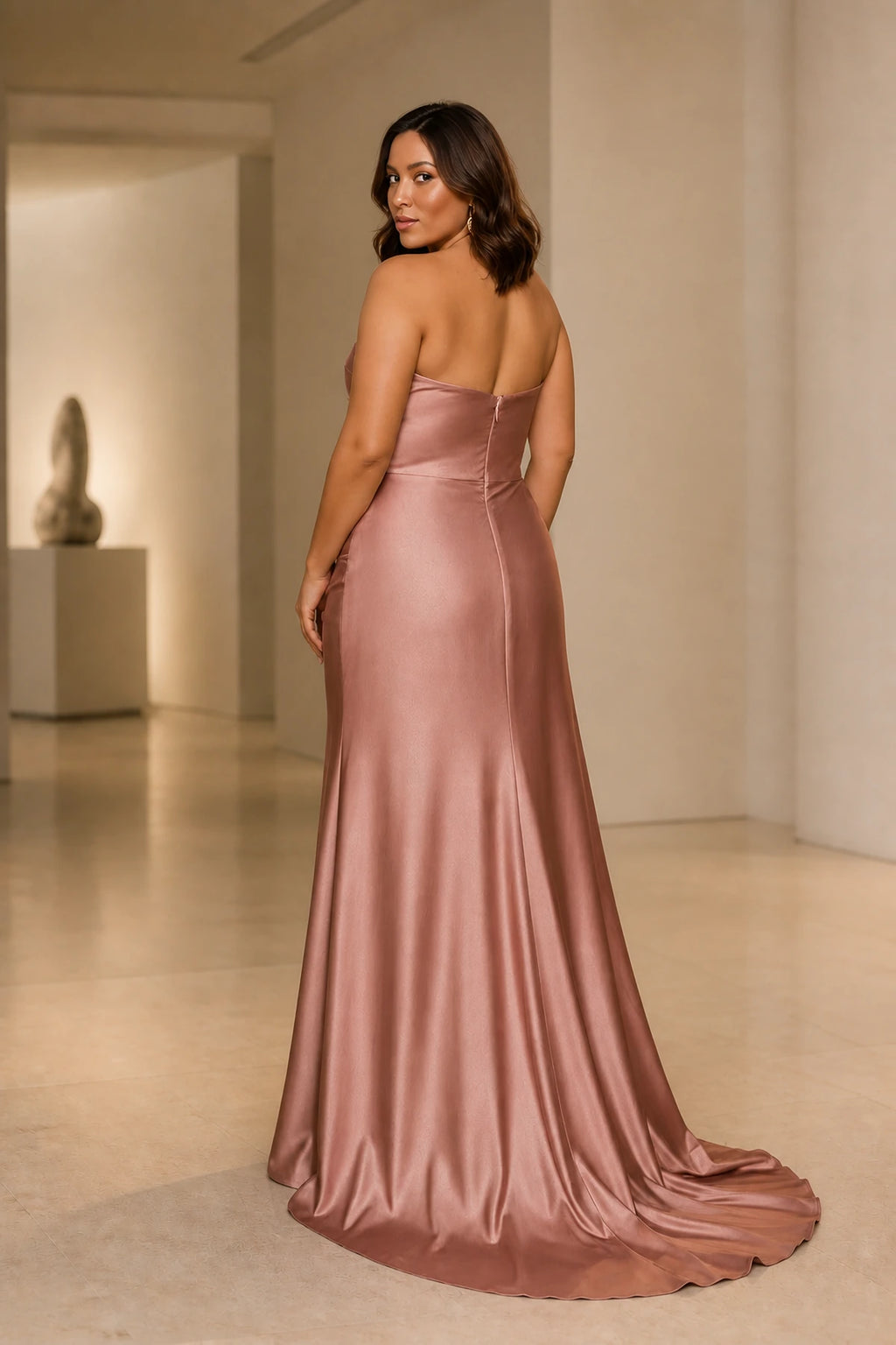 Plus size rose satin bridesmaid dress with low back and long flowing skirt