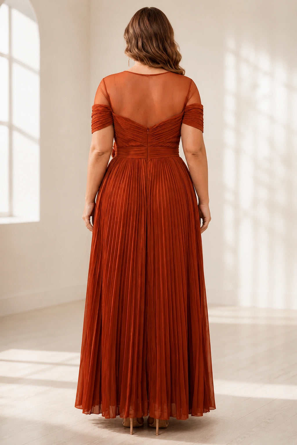 Plus size rust wedding guest dress with sheer back and center zipper