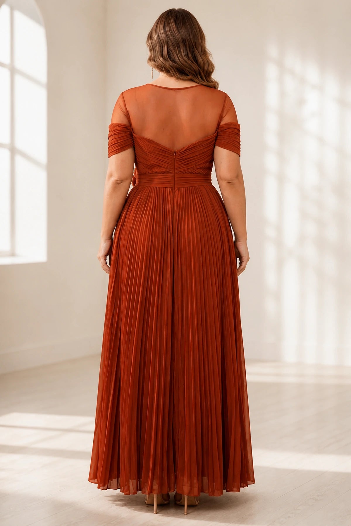 Plus size rust wedding guest dress with sheer back and center zipper