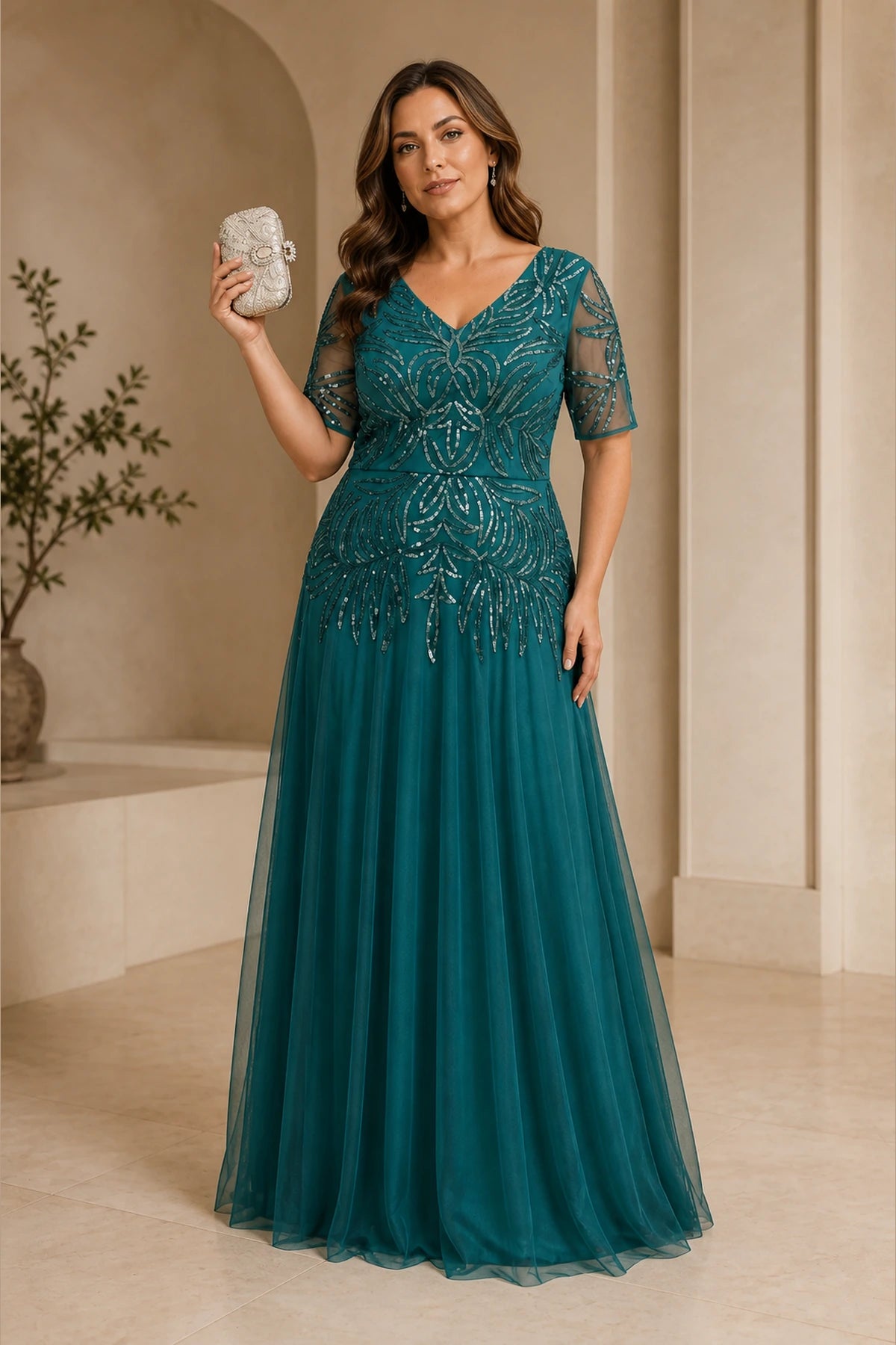 Plus size teal mother of the bride dress with V neckline and sequin bodice