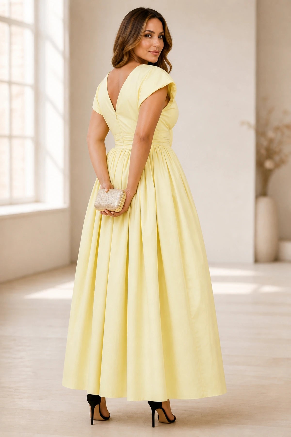Plus size yellow wedding guest dress with V back zipper and full skirt