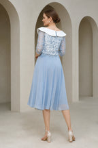 Powder blue A-line Mother of the Bride dress with white off-shoulder collar, lace bodice, three-quarter sleeves and zip back, front and back view by Vedress